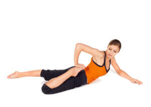 Woman stretches quadriceps