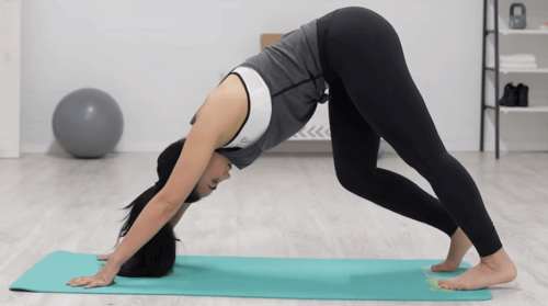 A woman doing a pike stretch.
