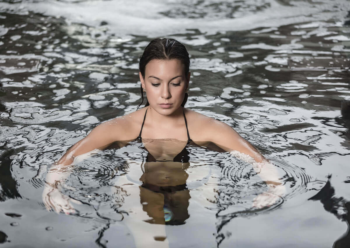 A woman doing hydrotherapy.