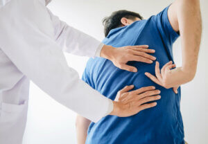 A man receiving treatment for muscle spasms.