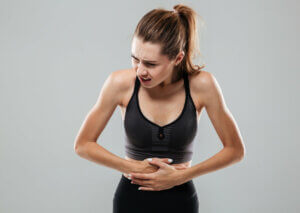 A woman suffering from indigestion.