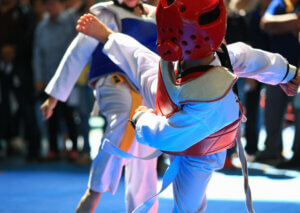 Children competing in taekwondo.