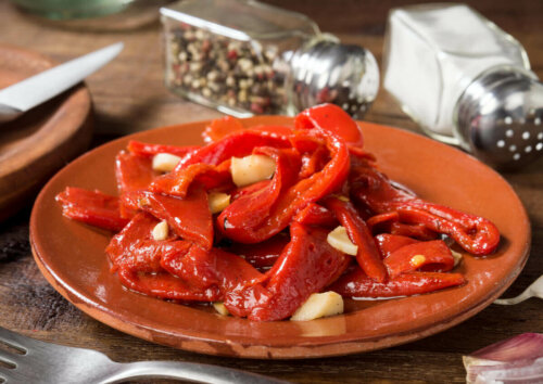Consuming spicy foods can help you avoid overeating. In this photo, a plate of red peppers.