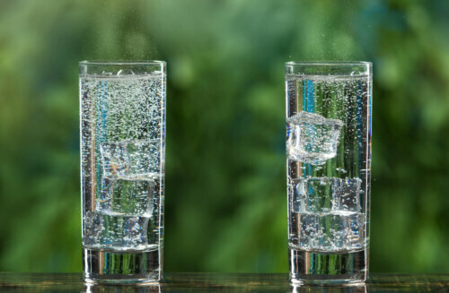 Two tall glasses of sparkling water.