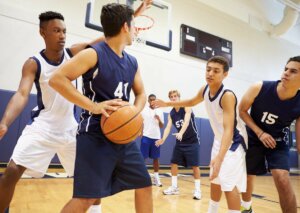 A group of basketball players in a game.