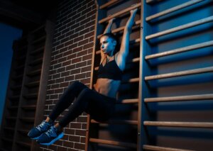 A woman exercising on bars on the gym.
