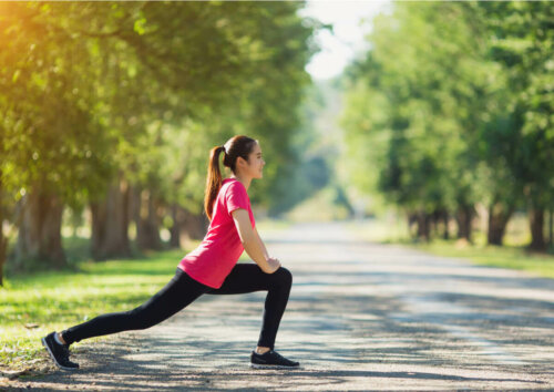 A woman stretching in the park.