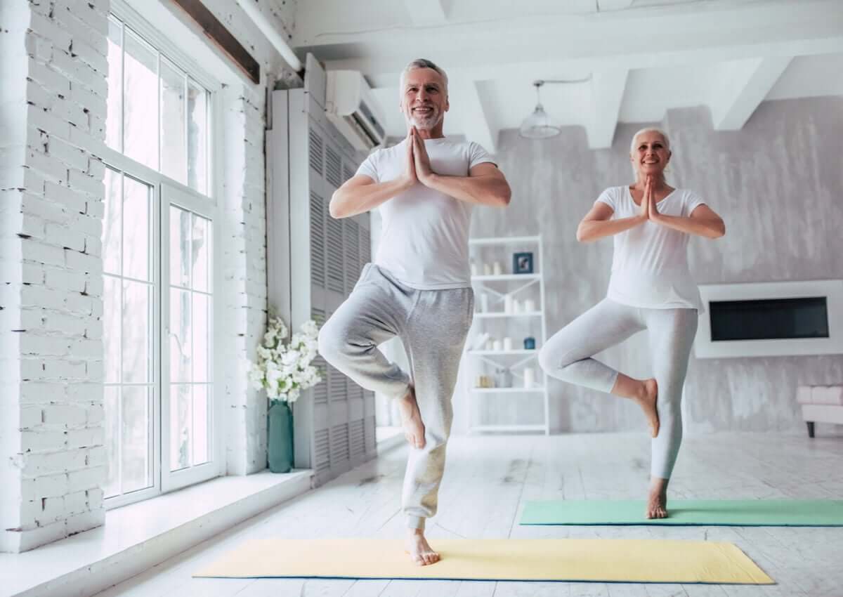 A older couple doing yoga.