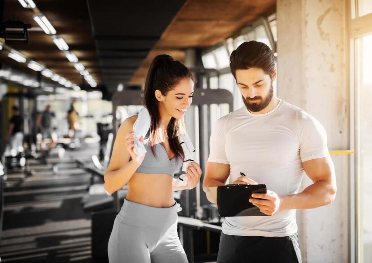 A personal trainer tracking his female client's progress.