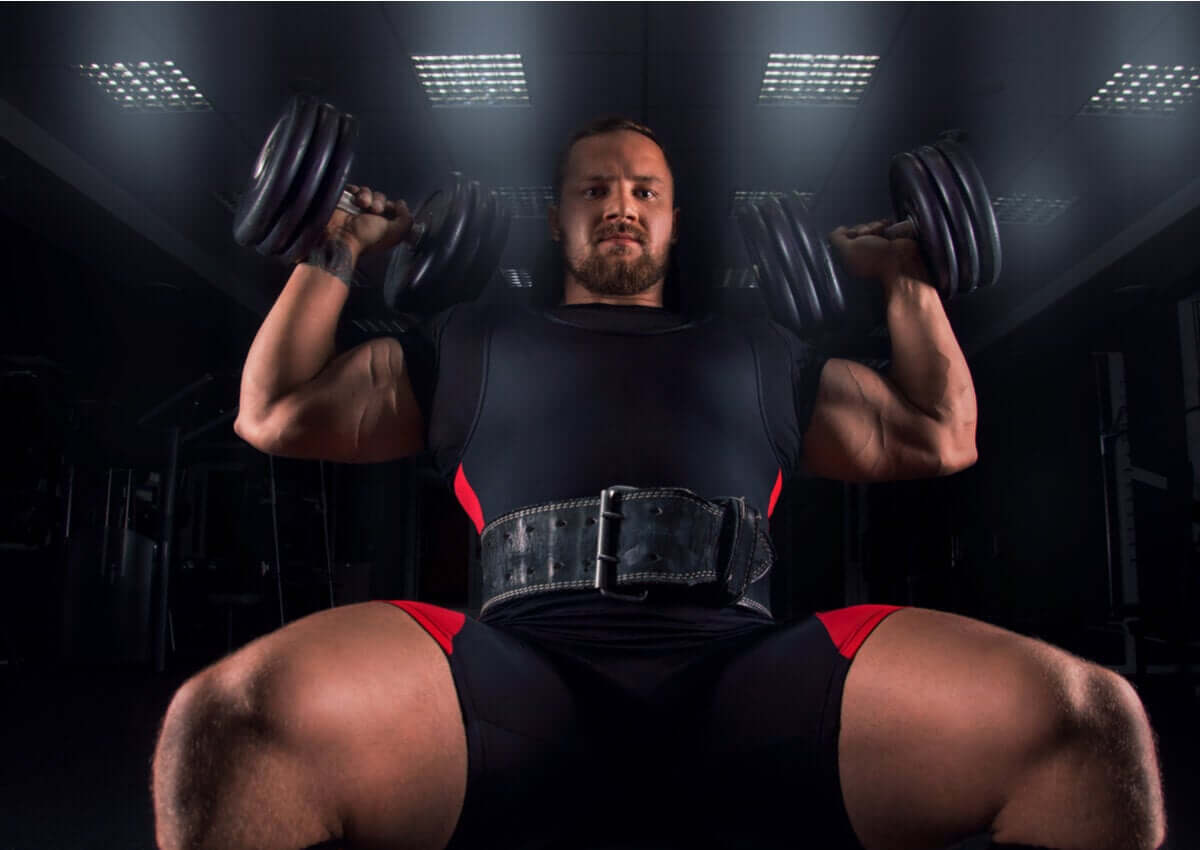A man doing the Arnold Press.