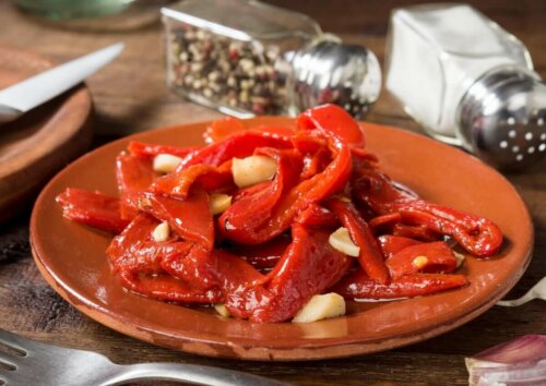 red peppers on a plate with garlic in a restaurant