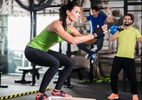 A group doing functional fitness training exercises.