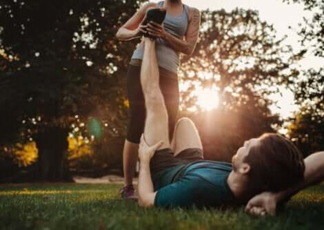A man stretching out a cramped muscle.