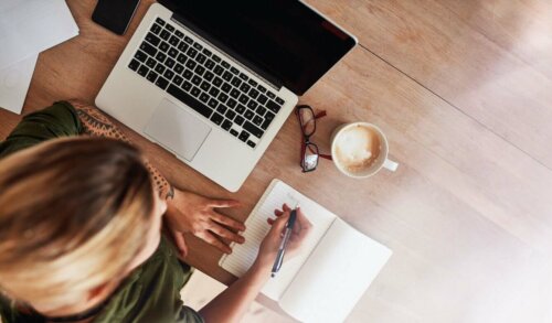 productive woman working at a desk; aerial shot