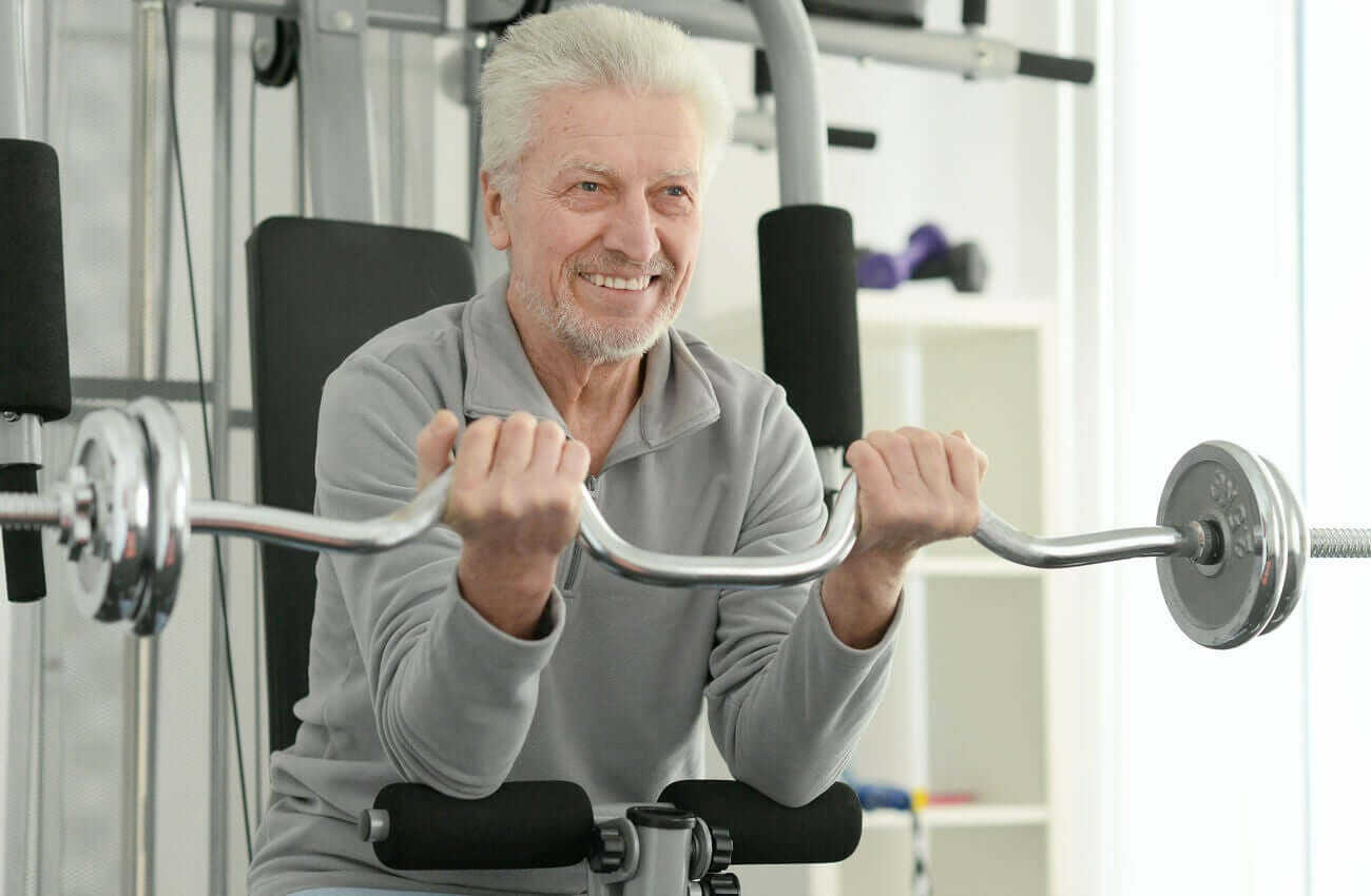 A senior lifting weights.