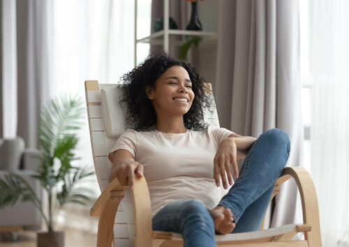 woman resting in a chair smiling
