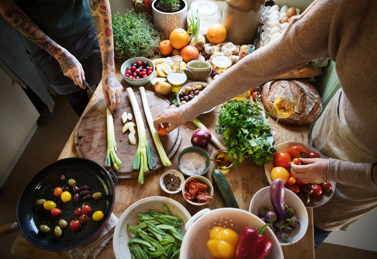 A table full of fruits and vegetables for meal prepping.